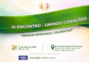 Cartaz com duas pessoas de mãos dadas no alto, logo abaixo uma faixa verde com o escrito no centro "3° encontro unindo corações".